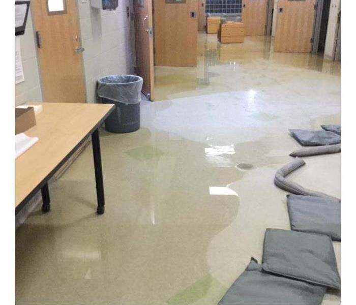 water is on the ground of a commercial property